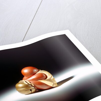 Netsuke abstract doll leaning over a bell by Unknown