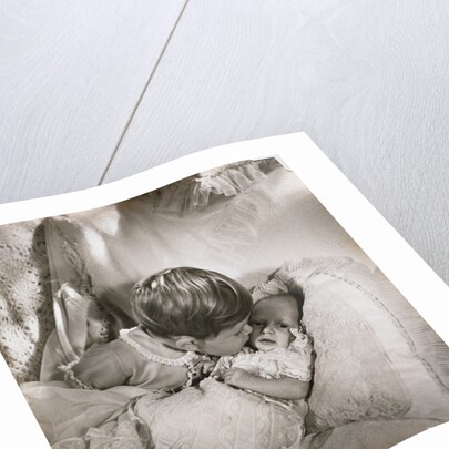 Prince Charles at the age of 18 months, kissing baby Princess Anne by Cecil Beaton