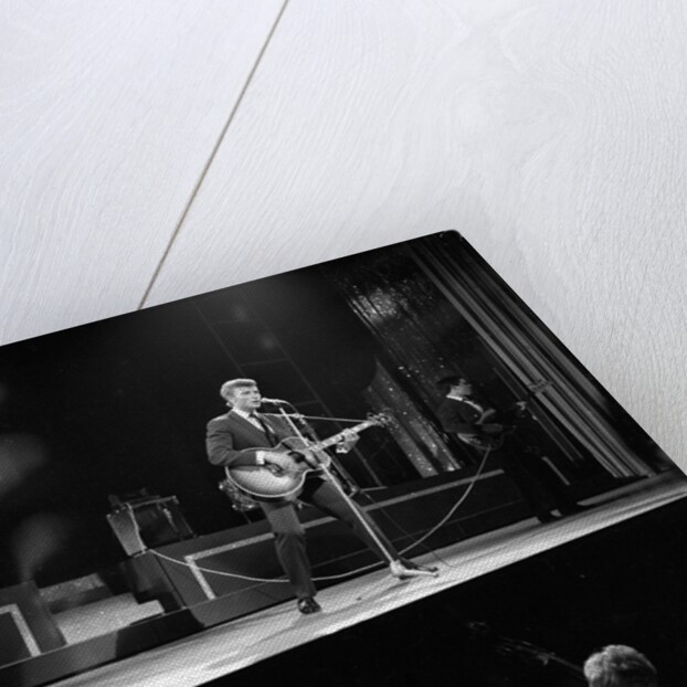 Johnny Hallyday with band performing on the Palladium Stage by Harry Hammond