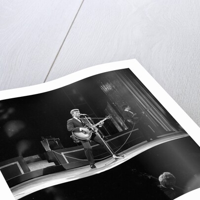 Johnny Hallyday with band performing on the Palladium Stage by Harry Hammond