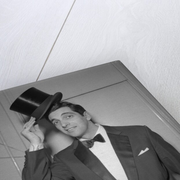 Frankie Vaughan posing with a hat by Harry Hammond