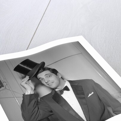Frankie Vaughan posing with a hat by Harry Hammond