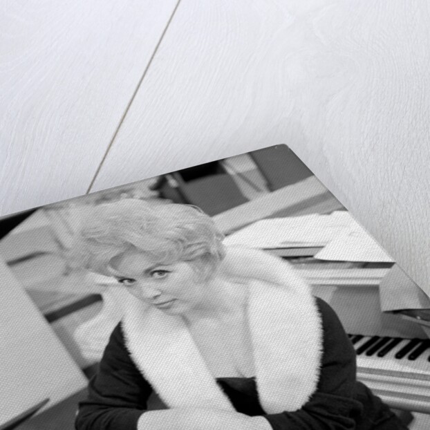 Marion Ryan, 1950s British pop singer, seated by a piano by Harry Hammond
