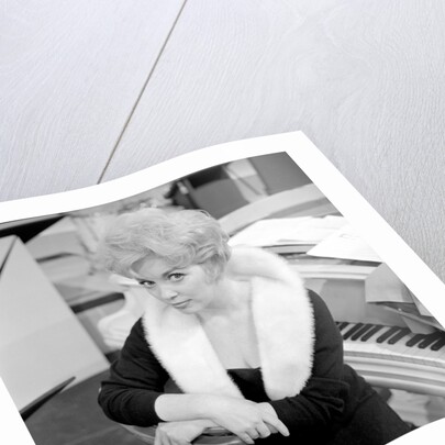Marion Ryan, 1950s British pop singer, seated by a piano by Harry Hammond