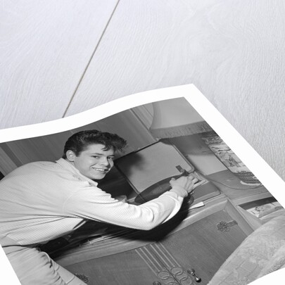 Cliff Richard playing records by Harry Hammond