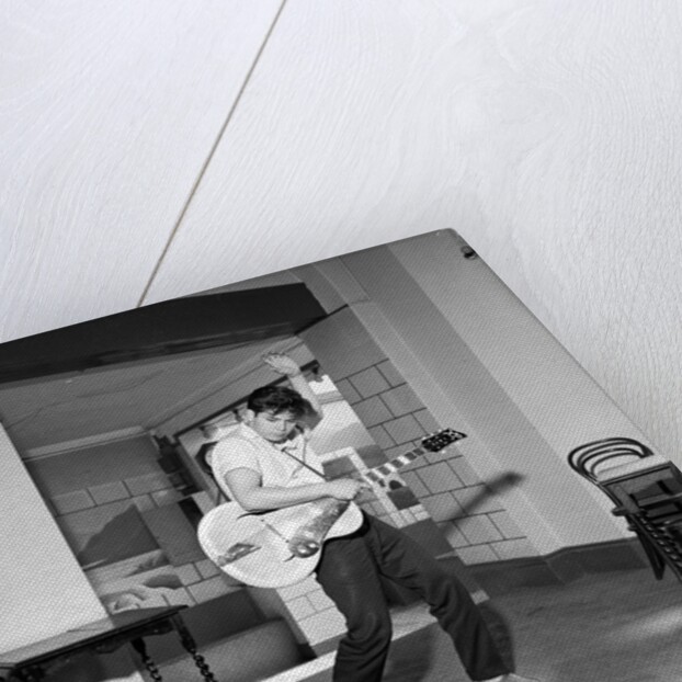 Cliff Richard playing the guitar by Harry Hammond