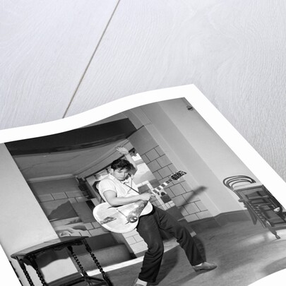 Cliff Richard playing the guitar by Harry Hammond