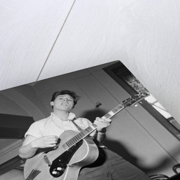 Cliff Richard playing the guitar by Harry Hammond
