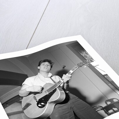 Cliff Richard playing the guitar by Harry Hammond