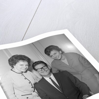 Roy Orbison posing with two fans by Harry Hammond