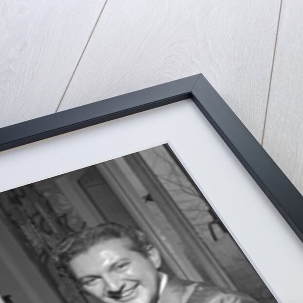 Liberace playing the piano at the Savoy Hotel by Harry Hammond