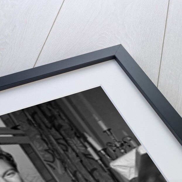 Liberace playing the piano at the Savoy Hotel by Harry Hammond