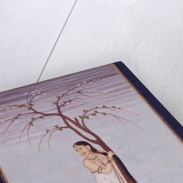 A lady standing beneath a tree braiding or drying her hair by Unknown