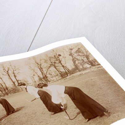 Four ladies playing hockey by Andrew Pitcairn-Knowles