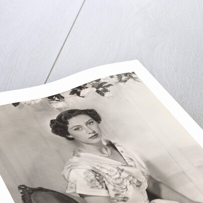 Princess Margaret sitting on a chair by Cecil Beaton