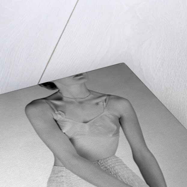 Model wearing girdle with suspender belt by John French