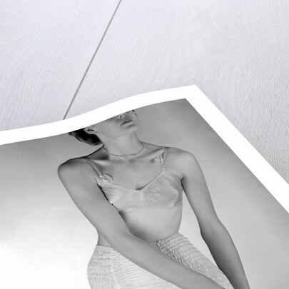 Model wearing girdle with suspender belt by John French