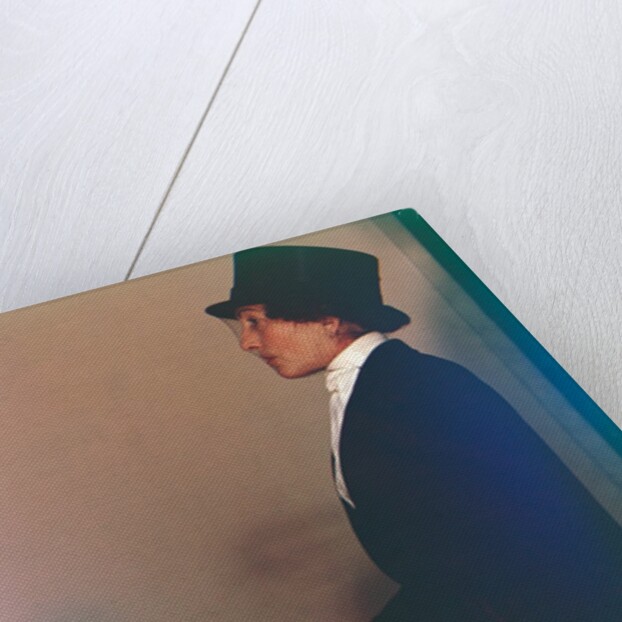 Woman in top hat sitting by Curtis Moffat