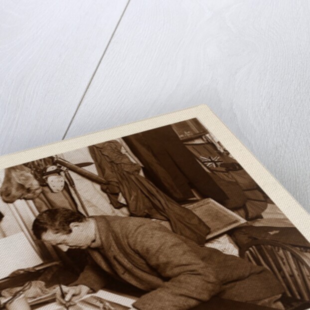 Dr. Edward Adrian Wilson colouring a sketch by Herbert George Ponting