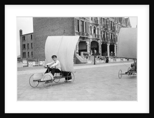 Boys racing on the promenade by Andrew Pitcairn-Knowles