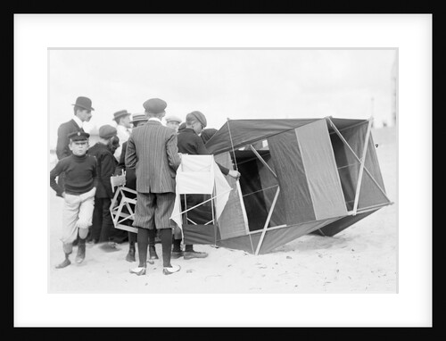 Large black box kite grounded by Andrew Pitcairn-Knowles