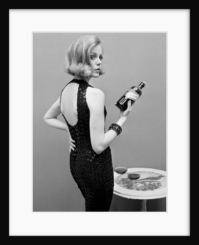 Model holding bottle of poison by John French