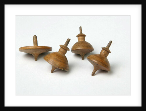 Miniature spinning tops by Unknown