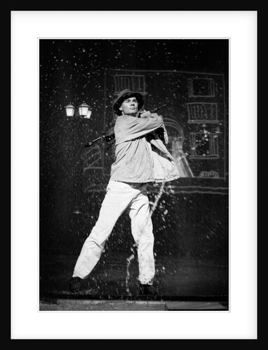 Paul Robinson in Betty Comden and Adolph Green's SinginÆ in the Rain at the National Theatre by Graham Brandon