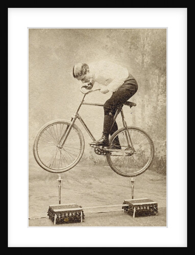 Trick Cyclist Balancing on Candles by Anonymous