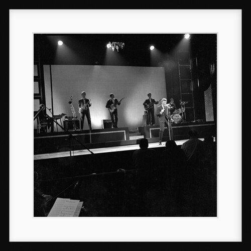 Johnny Hallyday with band performing on the Palladium Stage by Harry Hammond