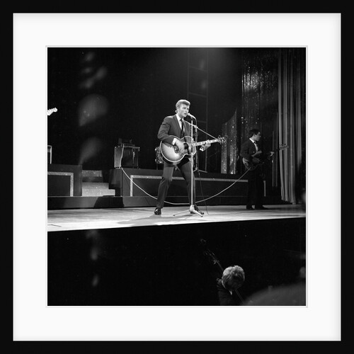 Johnny Hallyday with band performing on the Palladium Stage by Harry Hammond