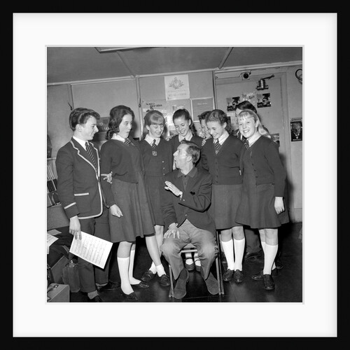 Norman Vaughan with group of school girls by Harry Hammond