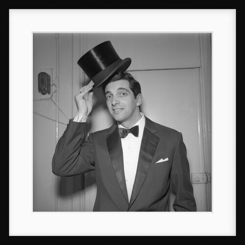 Frankie Vaughan posing with a hat by Harry Hammond