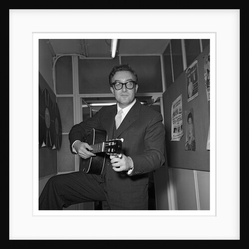 Peter Sellers holding a guitar by Harry Hammond
