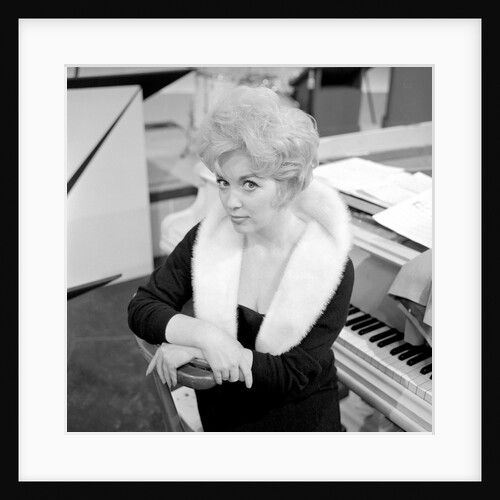 Marion Ryan, 1950s British pop singer, seated by a piano by Harry Hammond