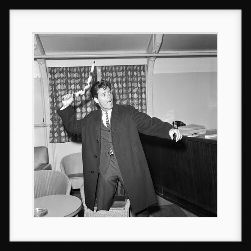 Cliff Richard playing with a boomerang by Harry Hammond