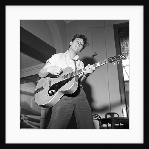 Cliff Richard playing the guitar by Harry Hammond