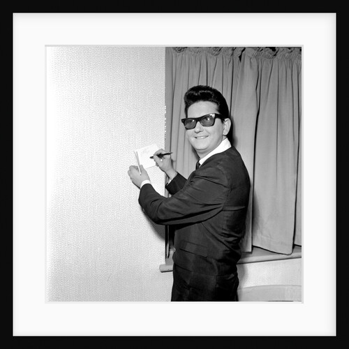 Roy Orbison signing an autograph by Harry Hammond