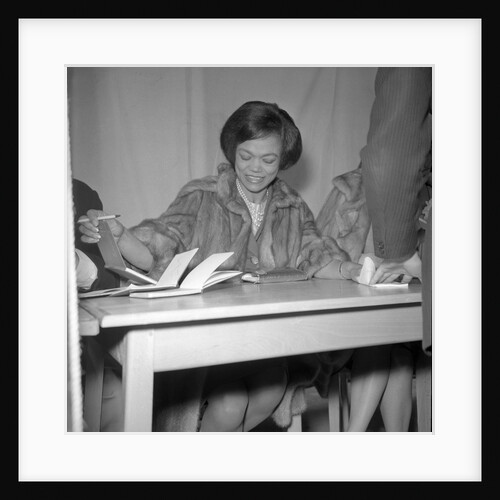 Eartha Kitt signing autographs by Harry Hammond
