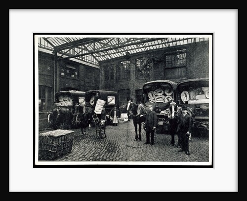 Loading up new matresses for delivery in the yard of Torrington Place by Unknown