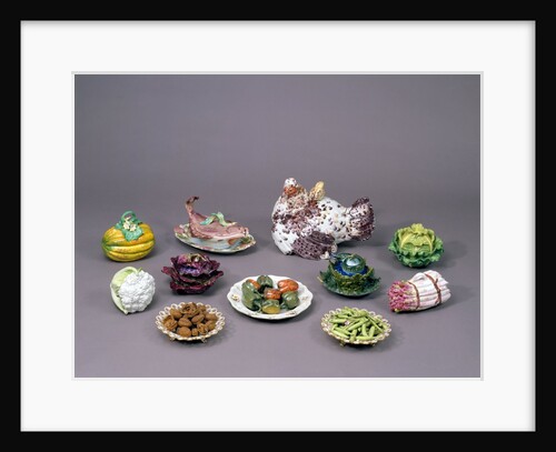 Arrangement of ceramic tureens and trick plates in the shape of vegetables and other food by Unknown