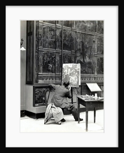 A student painting a copy of the Spanish Retable by Anonymous