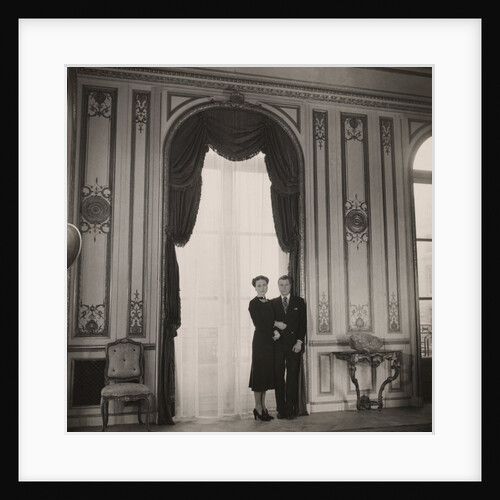 The Duke and Duchess of Windsor posing against a large window by Cecil Beaton