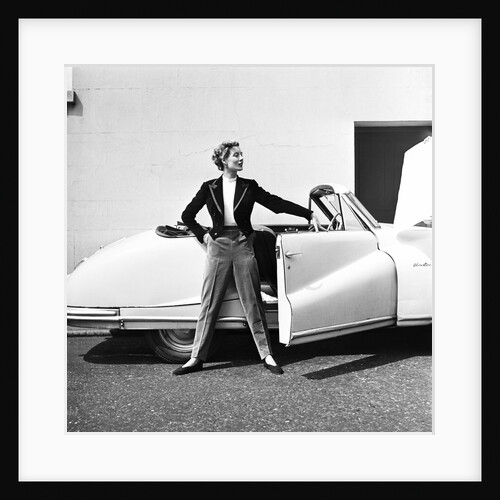 Model beside open door of Austin of England A90 Atlantic Sports saloon convertible by Elsbeth Juda