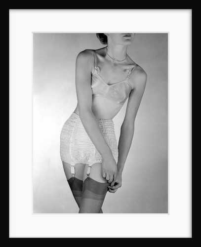 Model wearing girdle with suspender belt by John French