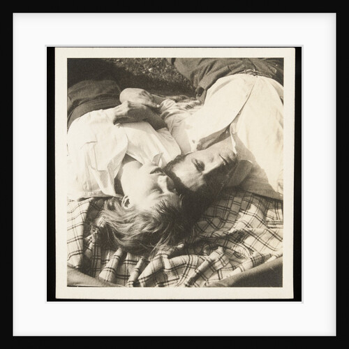Man and woman lying head by head on rug on grass by Curtis Moffat
