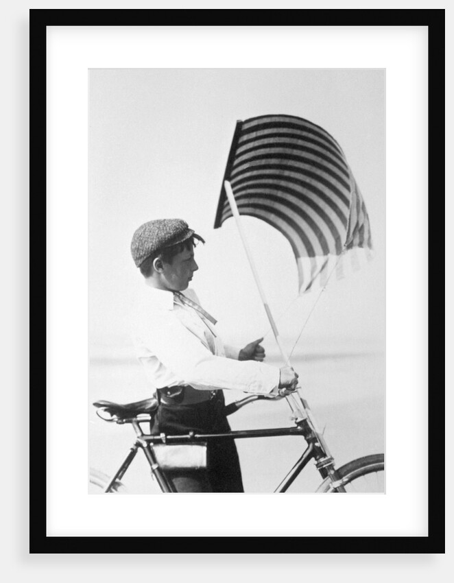 Adjusting the sail on the bike by Andrew Pitcairn-Knowles