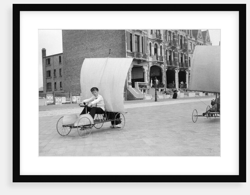 Boys racing on the promenade by Andrew Pitcairn-Knowles