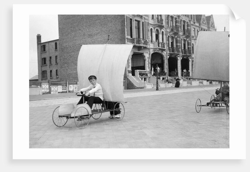 Boys racing on the promenade by Andrew Pitcairn-Knowles