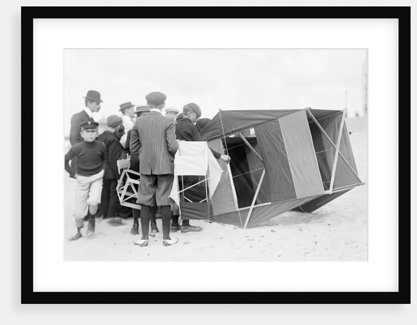 Large black box kite grounded by Andrew Pitcairn-Knowles